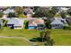 Aerial view of home with pool, near golf course at 10643 Old Grove Cir, Bradenton, FL 34212