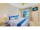 Main bedroom with a king-size bed and access to the pool at 10643 Old Grove Cir, Bradenton, FL 34212