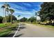 Landscaped street view of Greenfield Plantation community at 10643 Old Grove Cir, Bradenton, FL 34212