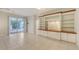 Bright Gathering room with built-in shelving and tiled floors at 10643 Old Grove Cir, Bradenton, FL 34212