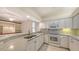 Kitchen with granite countertops and white cabinets at 10643 Old Grove Cir, Bradenton, FL 34212