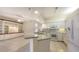 White kitchen with granite countertops at 10643 Old Grove Cir, Bradenton, FL 34212