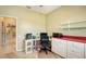 Home office with built-in desk and storage at 10643 Old Grove Cir, Bradenton, FL 34212