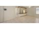 Office with built-in shelving and tile floors at 10643 Old Grove Cir, Bradenton, FL 34212