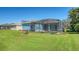 Inviting pool and patio area with lush landscaping and screened enclosure at 10643 Old Grove Cir, Bradenton, FL 34212