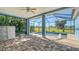 Screened-in pool and patio area with golf course view at 10643 Old Grove Cir, Bradenton, FL 34212