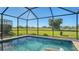 Screened pool with golf course views and water features at 10643 Old Grove Cir, Bradenton, FL 34212