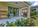 Outdoor covered patio with an open design, patio table, and decorative plants at 12939 Seasong Ter, Bradenton, FL 34211