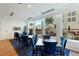 Bright breakfast room with blue chairs and pool view at 1350 Main St # 600, Sarasota, FL 34236