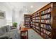 Well-lit library with comfortable seating and extensive bookshelves at 1350 Main St # 600, Sarasota, FL 34236