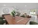 Bright dining room with wood table and green chairs at 154 Mercer St, Port Charlotte, FL 33954