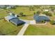 This aerial view shows the home and barn on this spacious lot at 25205 67Th E Ave, Myakka City, FL 34251