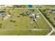 Vast land with a horse training circle, a central home, multiple outbuildings and ponds at 25205 67Th E Ave, Myakka City, FL 34251