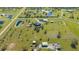 Wide aerial view of the expansive property with ponds, buildings, and well-maintained land at 25205 67Th E Ave, Myakka City, FL 34251