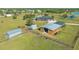 Aerial view of a horse property featuring horse barn at 25205 67Th E Ave, Myakka City, FL 34251