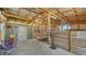 Interior shot of a barn with wooden stalls and a view of the outdoors at 25205 67Th E Ave, Myakka City, FL 34251