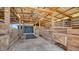 Interior shot of a barn with visible stalls and chairs on the side at 25205 67Th E Ave, Myakka City, FL 34251