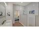 Modern bathroom features white subway tile, glass shower enclosure, and a view into the adjacent bedroom at 25205 67Th E Ave, Myakka City, FL 34251