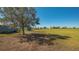 Picturesque view of horse property featuring lush green pasture with fenced areas and shelters at 25205 67Th E Ave, Myakka City, FL 34251