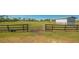 Pasture with gate and utility building at 25205 67Th E Ave, Myakka City, FL 34251