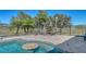 This outdoor pool features a swim up table and overlooks the lush, green backyard at 25205 67Th E Ave, Myakka City, FL 34251