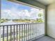 Scenic balcony view of a waterfront canal community with lush tropical landscaping at 4440 Tatum St, Port Charlotte, FL 33948