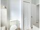 Bathroom featuring a toilet, closet and tiled shower/bath at 4440 Tatum St, Port Charlotte, FL 33948