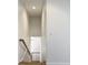 Hallway with wooden railings and a bright light at 4440 Tatum St, Port Charlotte, FL 33948