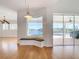 View of the living room featuring bay window with bench seating and slider door access to the lanai at 4440 Tatum St, Port Charlotte, FL 33948