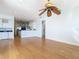 Open living room with wood floors offering seamless transition to the modern kitchen at 4440 Tatum St, Port Charlotte, FL 33948