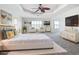 Spacious main bedroom with white walls, light gray carpet, and a luxurious king bed at 4440 Tatum St, Port Charlotte, FL 33948