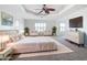 Airy main bedroom with walk-in closet, white furniture, and neutral decor at 4440 Tatum St, Port Charlotte, FL 33948