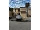 Condo building exterior with parking and a palm tree at 6312 7Th W Ave # 6312, Bradenton, FL 34209