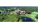 Aerial view of luxurious clubhouse and golf course at 6836 Bay Hill Dr, Bradenton, FL 34202