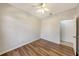 Bright bedroom with hardwood floors and access to a bathroom at 6836 Bay Hill Dr, Bradenton, FL 34202