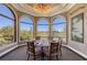 Private dining area with a round table and chairs overlooking a scenic view at 6836 Bay Hill Dr, Bradenton, FL 34202