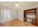 Bright home office features built-in shelving and hardwood floors at 6836 Bay Hill Dr, Bradenton, FL 34202