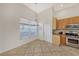 Bright kitchen nook with wood cabinets and tiled floor at 6836 Bay Hill Dr, Bradenton, FL 34202