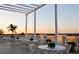 Relaxing patio with white furniture and sunset views at 6836 Bay Hill Dr, Bradenton, FL 34202