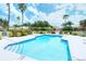 Community pool with lounge chairs and a shallow end at 6836 Bay Hill Dr, Bradenton, FL 34202