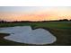 Golf course sand trap at sunset, showcasing the course's beauty at 6836 Bay Hill Dr, Bradenton, FL 34202