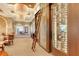 Wine cellar with a ladder and glass-front storage showcasing an impressive collection at 6836 Bay Hill Dr, Bradenton, FL 34202