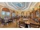 Rustic-chic wine room with wooden tables and a large wine rack at 6836 Bay Hill Dr, Bradenton, FL 34202