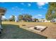 Large backyard with grassy area and shed at 7555 Hanchey St, North Port, FL 34287