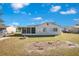 Home's backyard with grassy area at 7555 Hanchey St, North Port, FL 34287