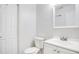 Clean and updated bathroom with white vanity and fixtures at 7555 Hanchey St, North Port, FL 34287