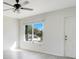 Bright living room with vinyl flooring and a large window at 7555 Hanchey St, North Port, FL 34287