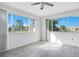 Living room with gray flooring and large windows at 7555 Hanchey St, North Port, FL 34287