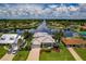 Aerial view of waterfront home with canal access and lush landscaping at 4440 Tatum St, Port Charlotte, FL 33948