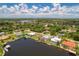 Aerial view of waterfront community, showcasing houses and waterways at 4440 Tatum St, Port Charlotte, FL 33948